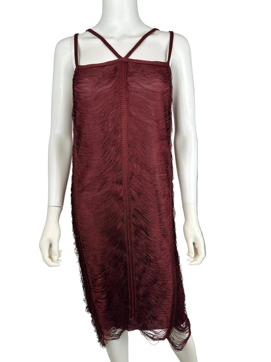 Mannequin wearing a burgundy dress with fringe details against a neutral background