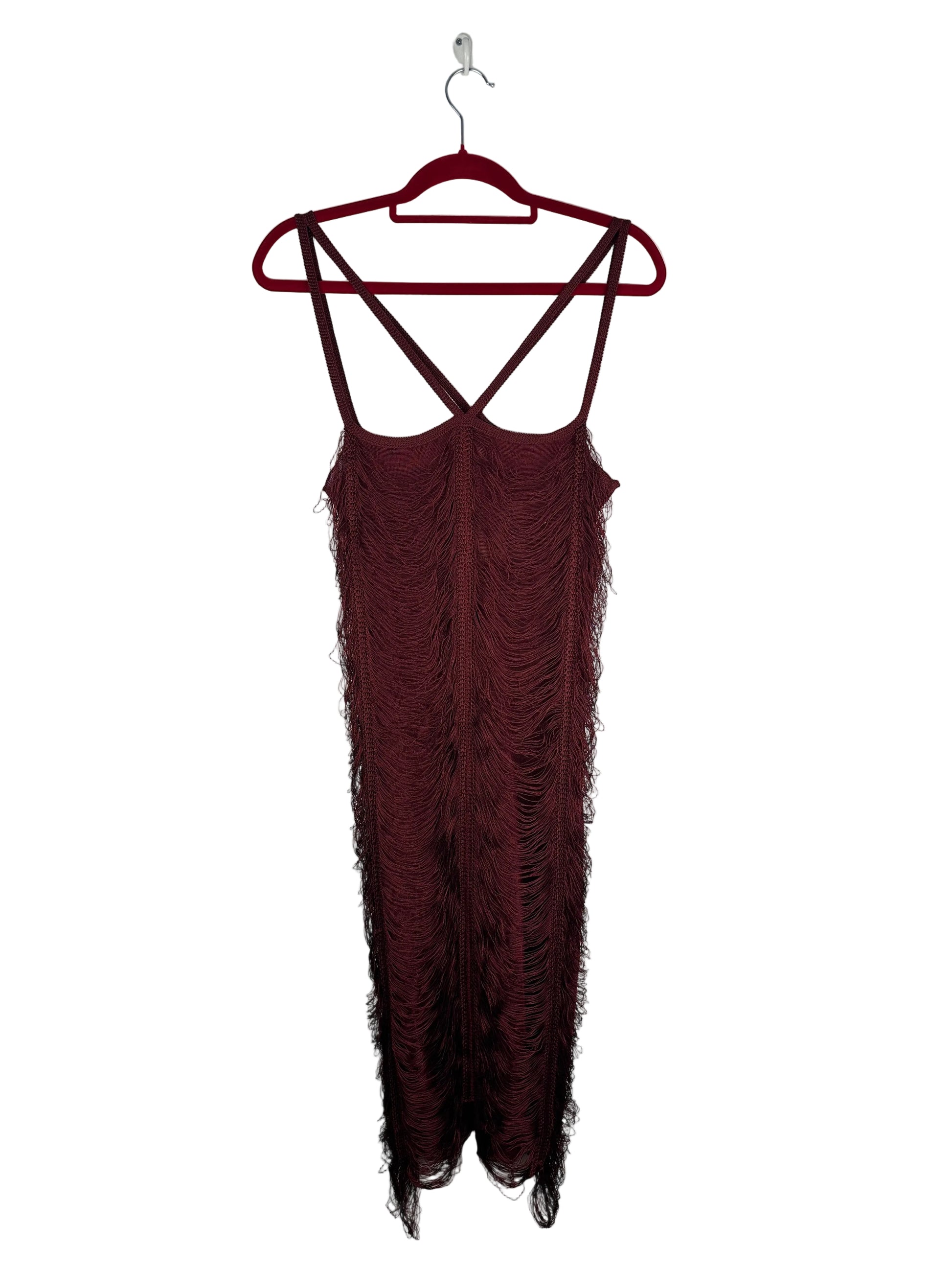 Maroon dress with fringe details on a hanger against a light gray background