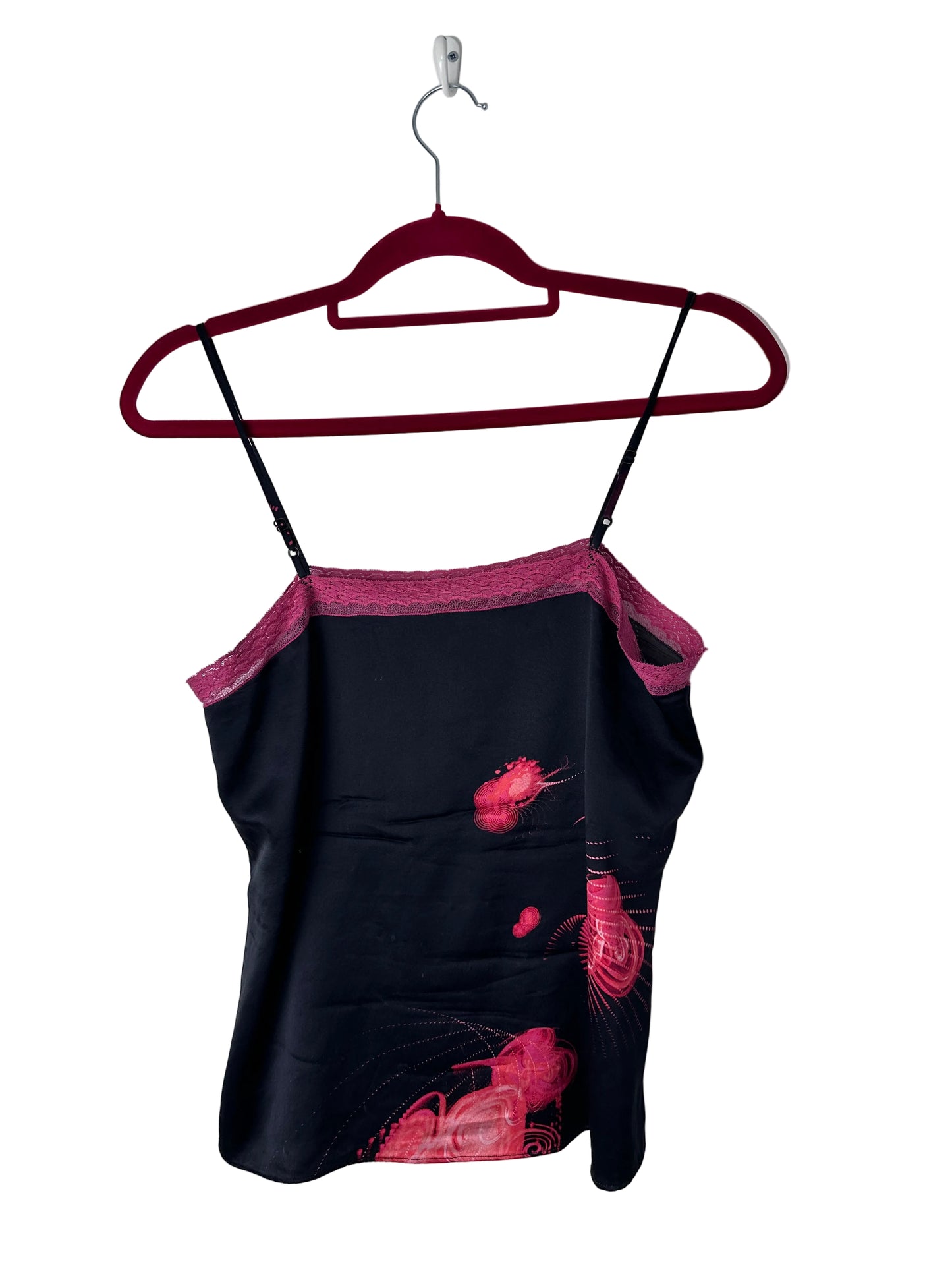 Black printed cami top on a red hanger
