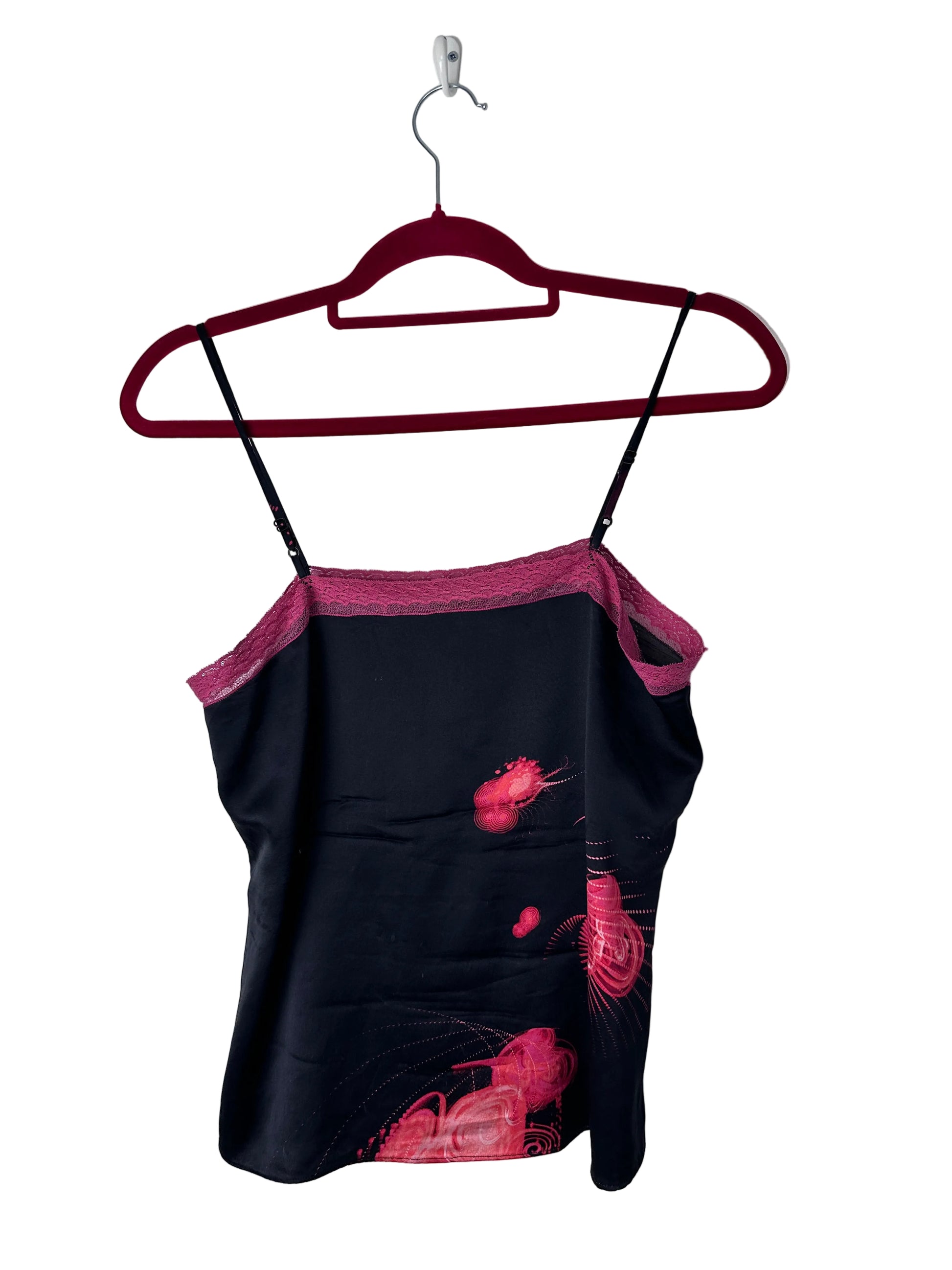 Black printed cami top on a red hanger