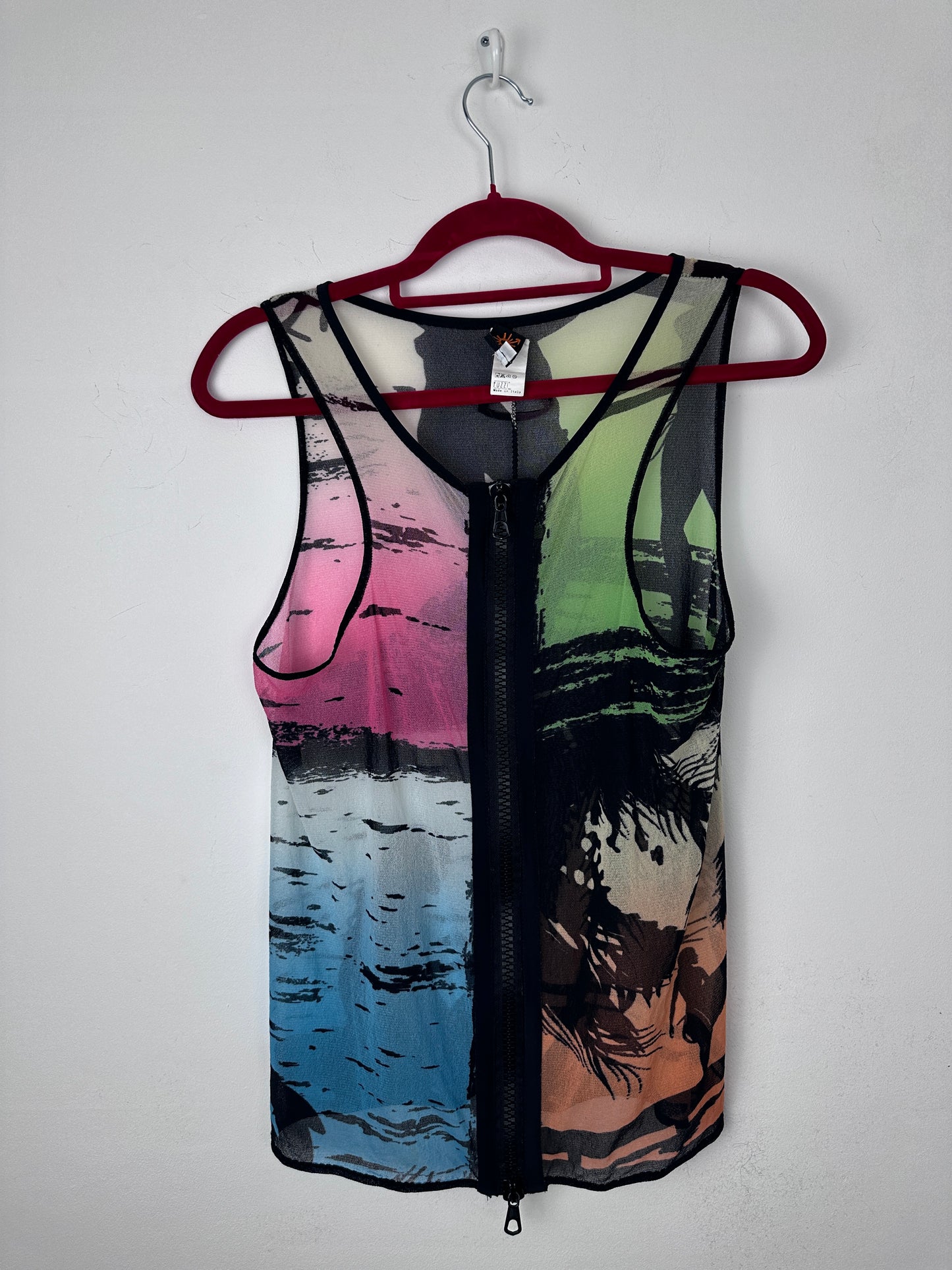 A sleeveless mesh vest with a colorful abstract landscape print, featuring a red hanger and a black zipper closure, laid flat against a white background.