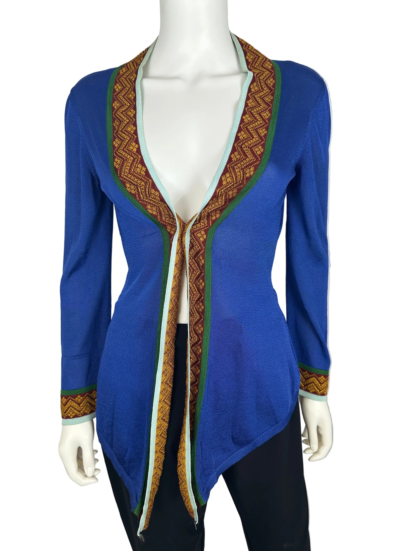 Blue cardgan with intricate patterns on a mannequin against a gray background