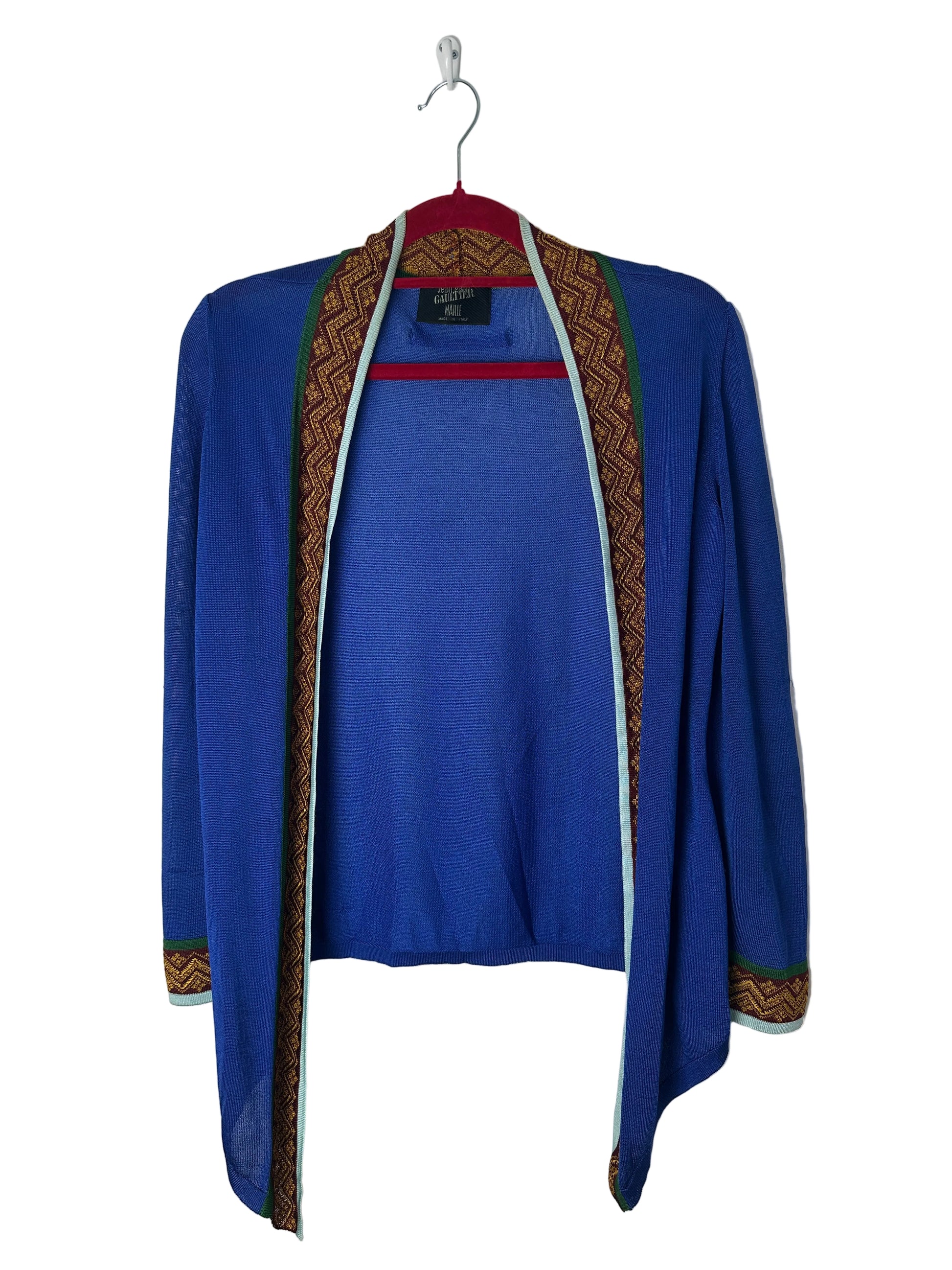 Blue jacket with intricate patterns on a white background