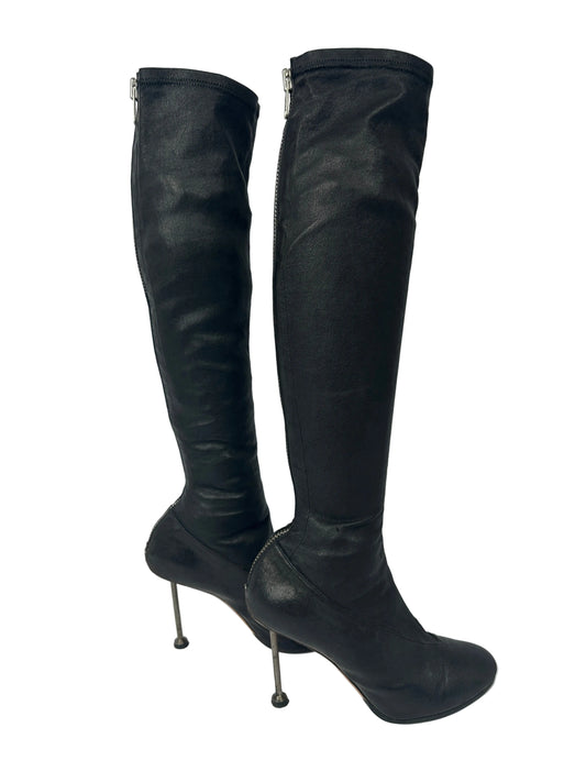 Black knee-high boots on a white background