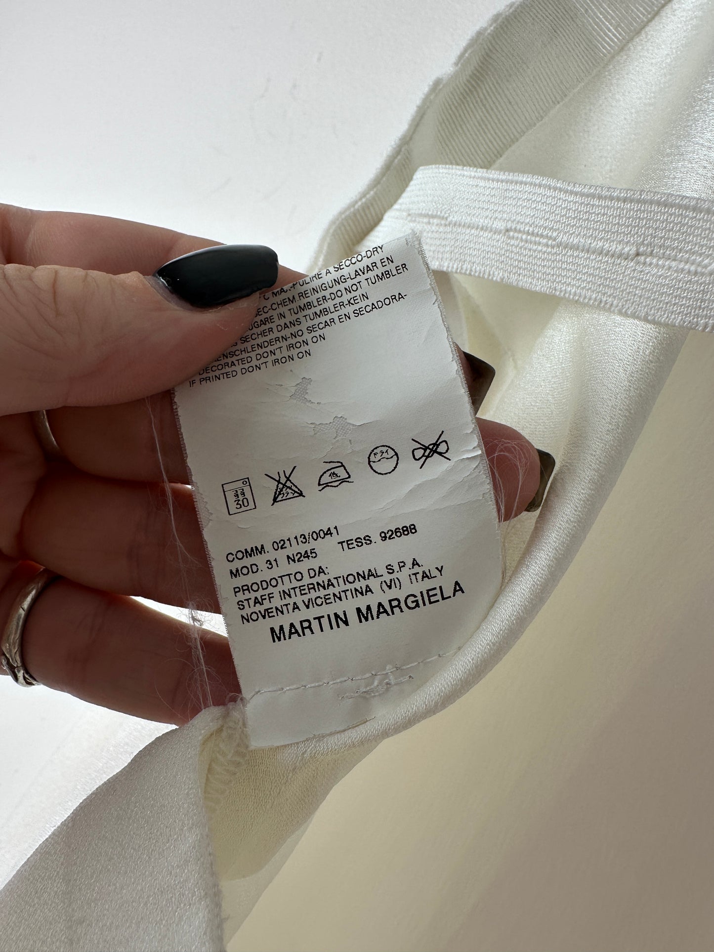 Close up of a martin margiela care label