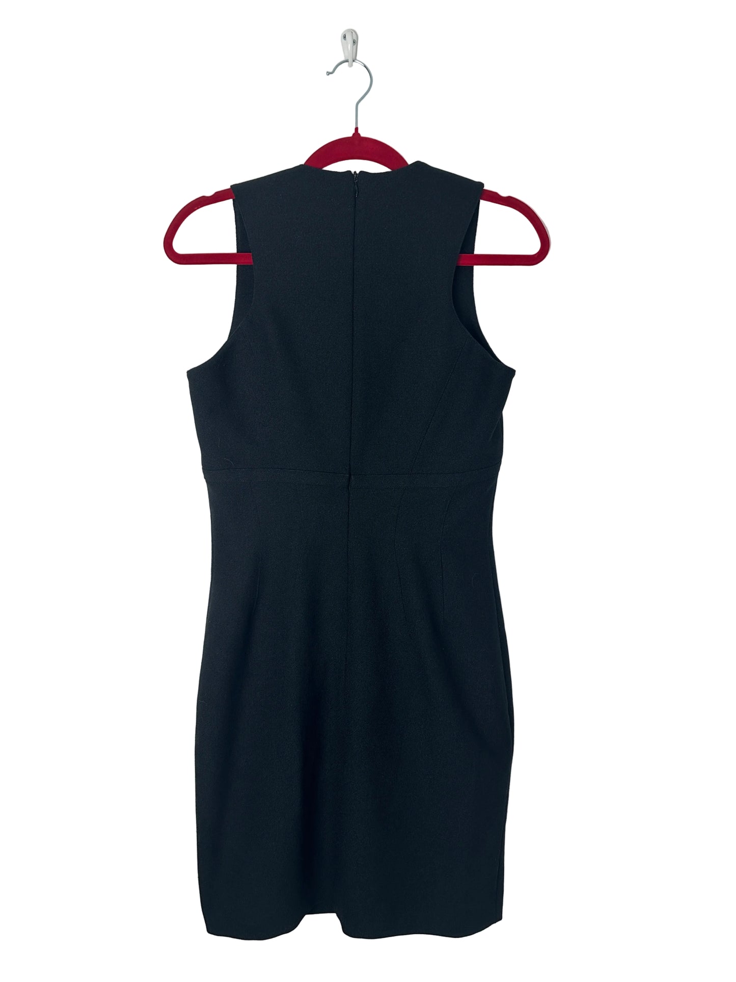 Black dress on a red hanger against a light gray background