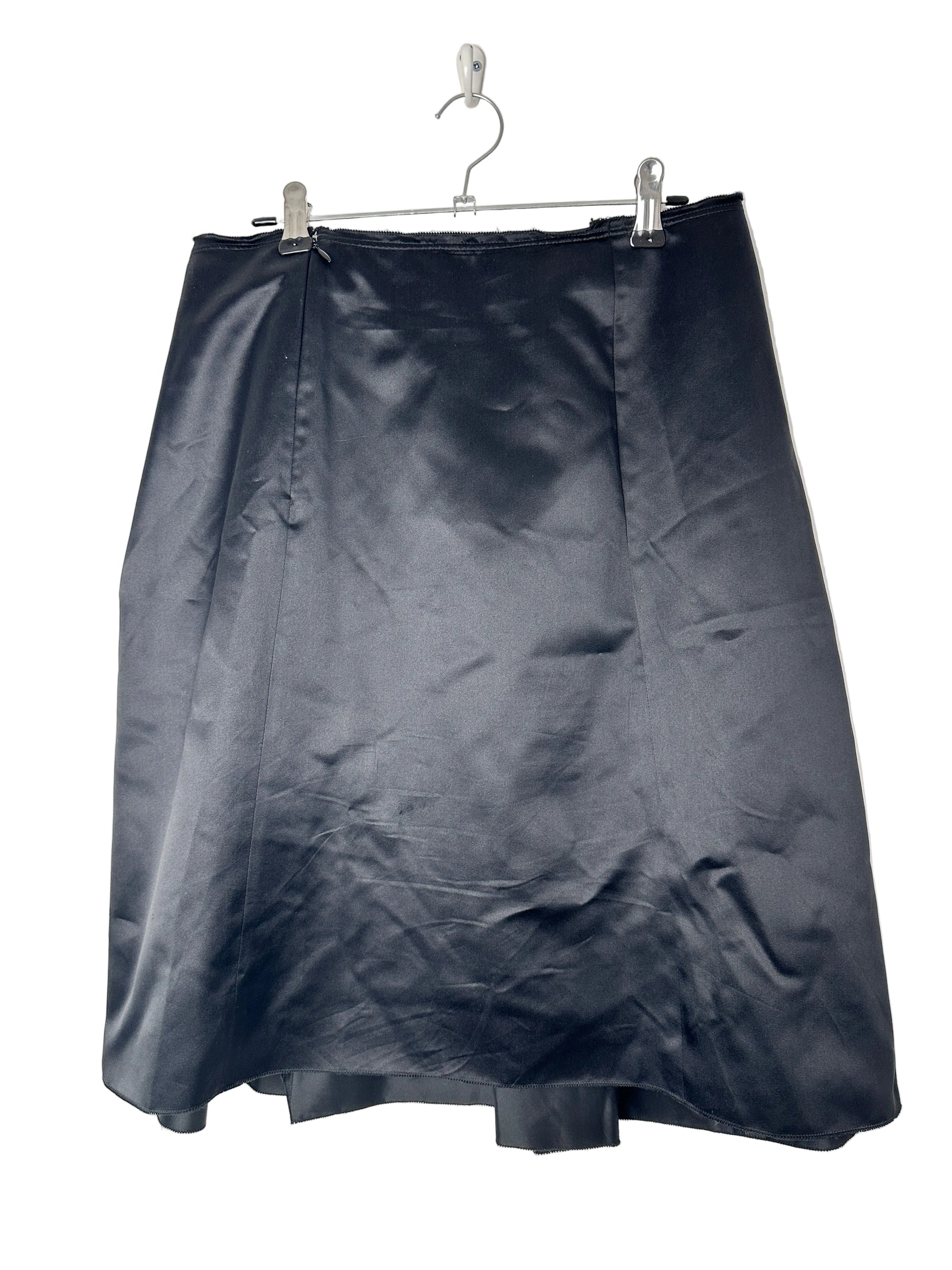 Black jacket on a hanger against a white background