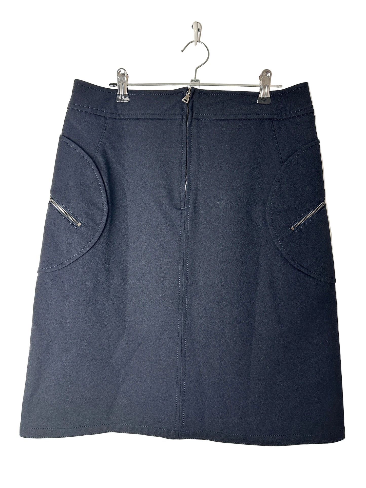 Black skirt on a beige background