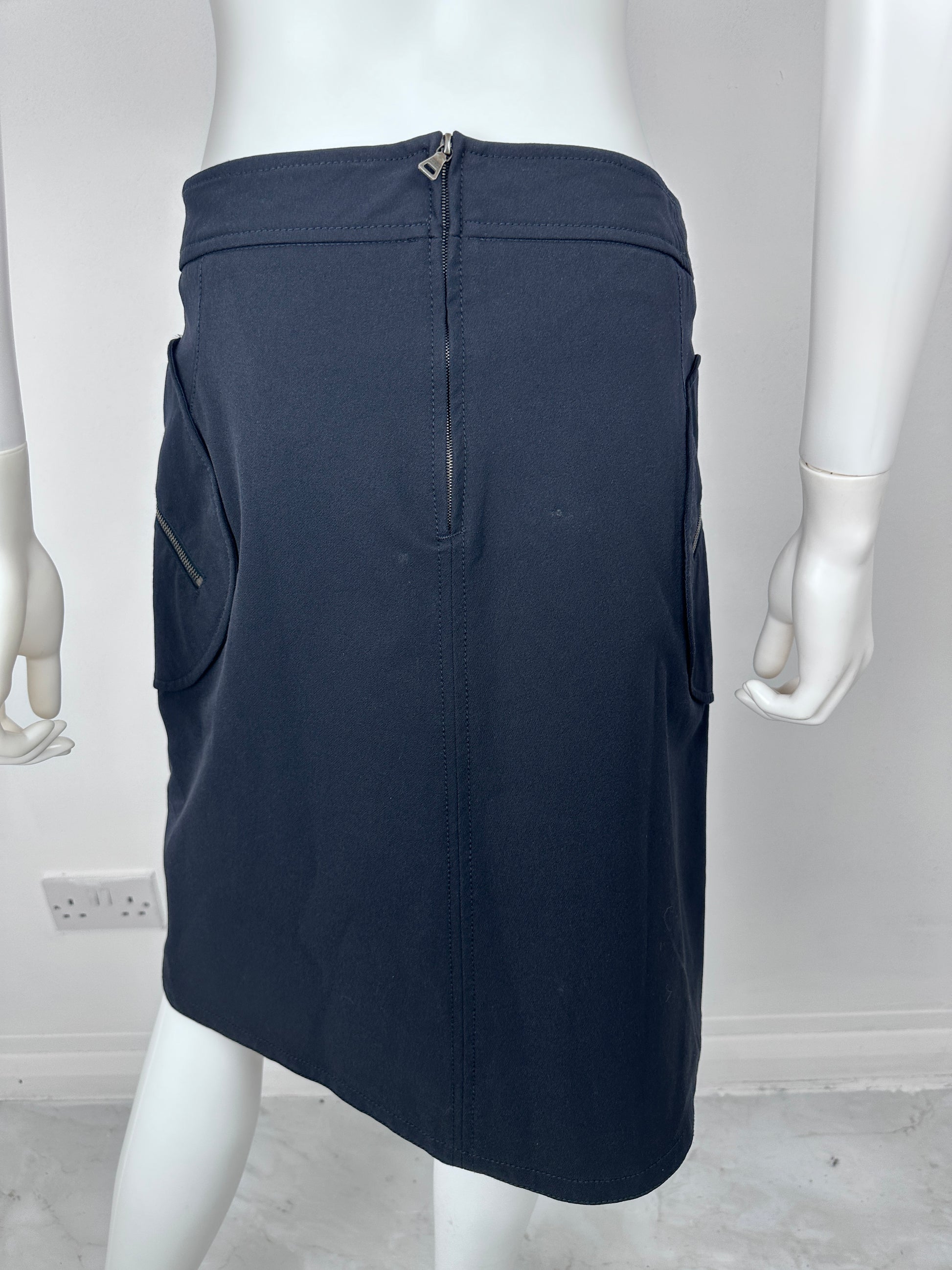 Navy blue garment on a mannequin against a white background