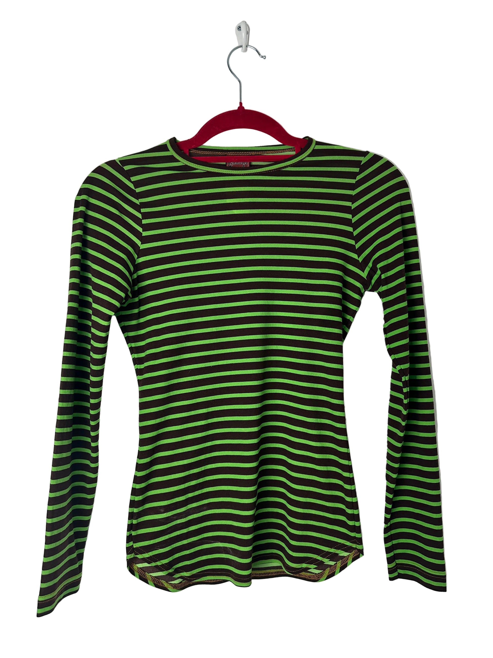 Green and black striped shirt on a hanger against a white background