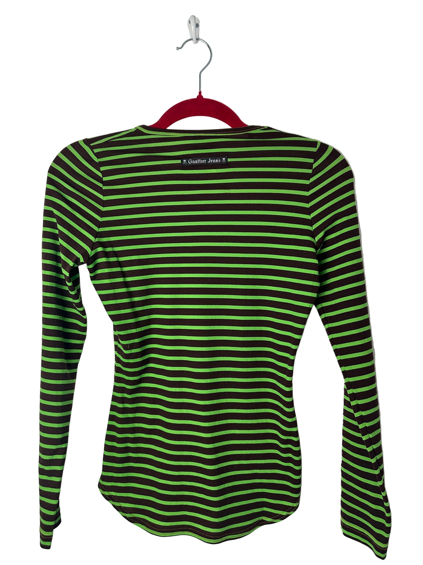 Green and black striped shirt on a hanger against a white background