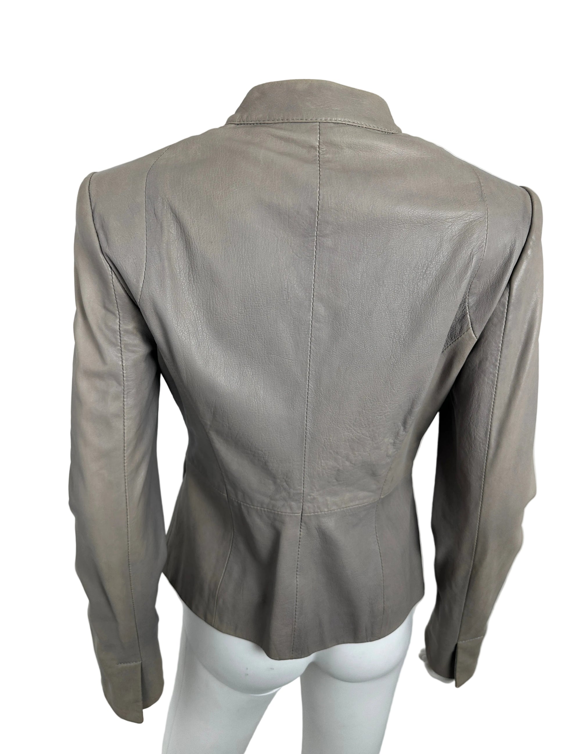 Gray leather jacket on a mannequin against a white background