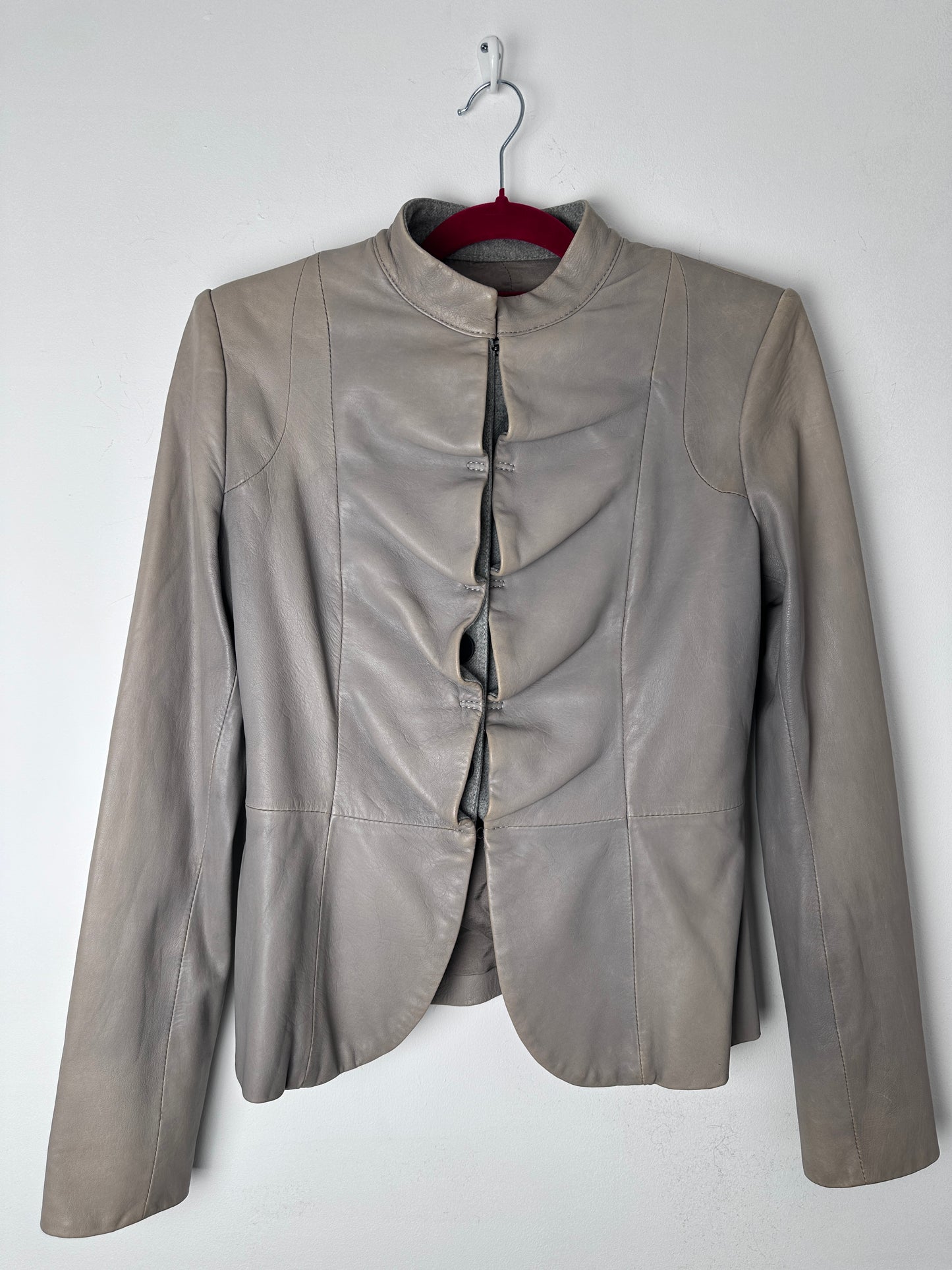 Gray leather jacket on a white background